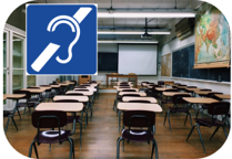 A classroom with desks and chairs. International Symbol of access for hearing loss.